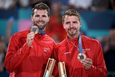 Paris Olympics Men's beach volleyball: Norway's Anders Berntsen Mol, left, and Christian Sandlie Sorum celebrate bronze medal